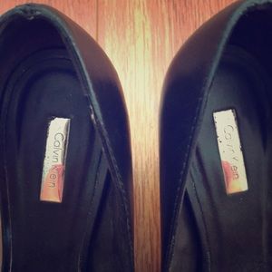 Black Calvin Klein pumps